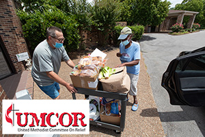 UMCOR people delivering emergency food