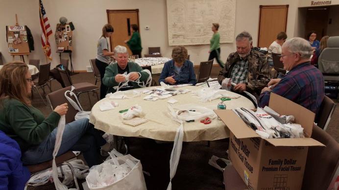 Work Group preparing plastic bags for the loom.