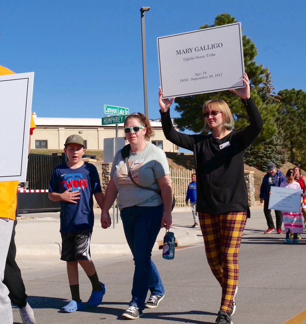 Walkers carrying signs