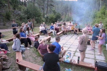 large group around campfire