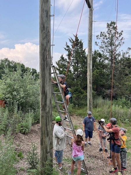 climbers on ropes course