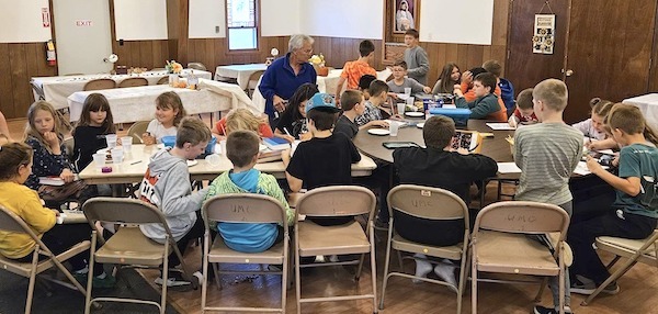 Kids at table in church