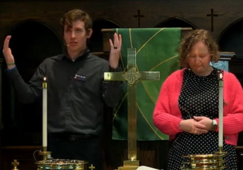 Two pastors offering communion
