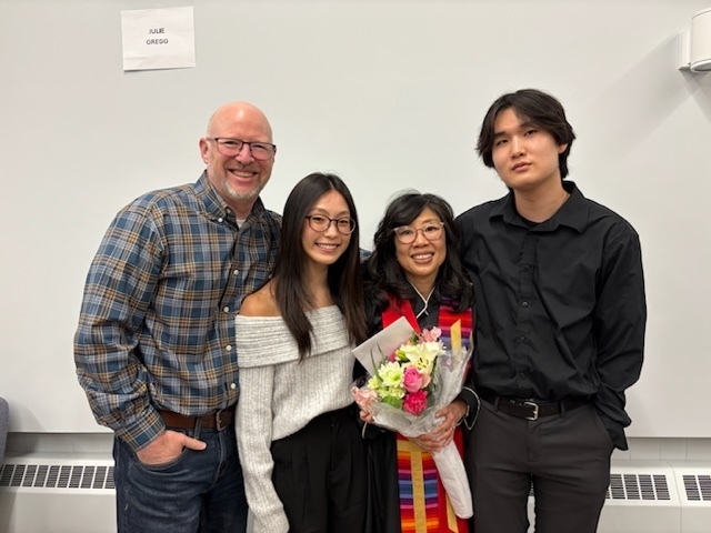 Four persons with flower bouquet