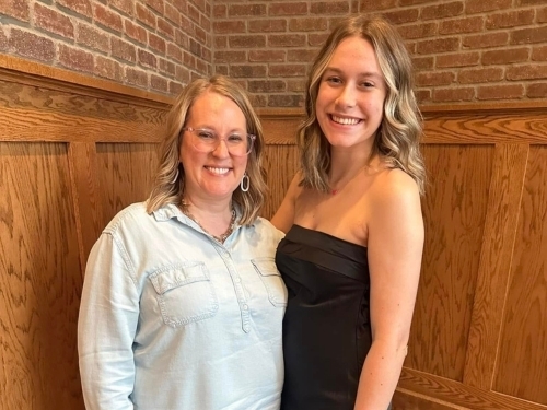 Mother and daughter smiling