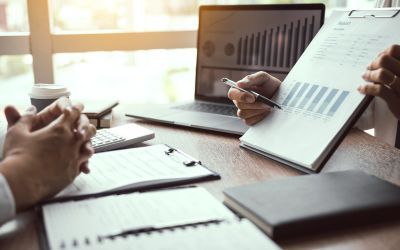 hands and finance charts