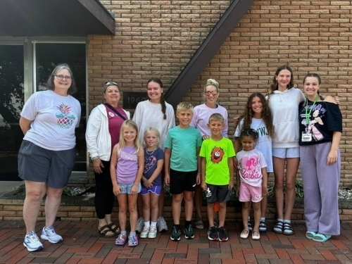 Campers at chapel wall
