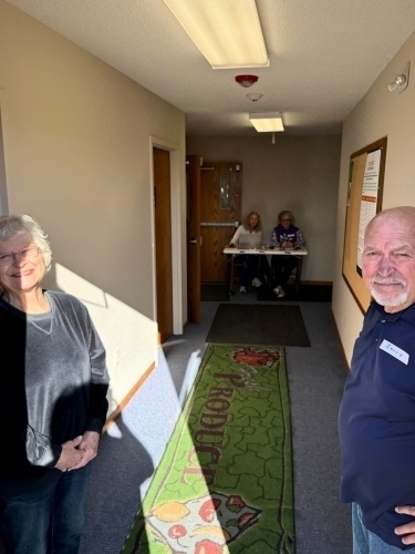 Greeters in church hallway