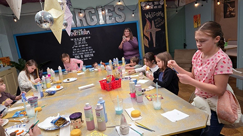 youth making crafts around table